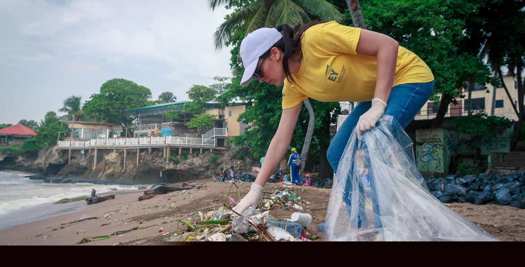 volunteer cleaning up trash