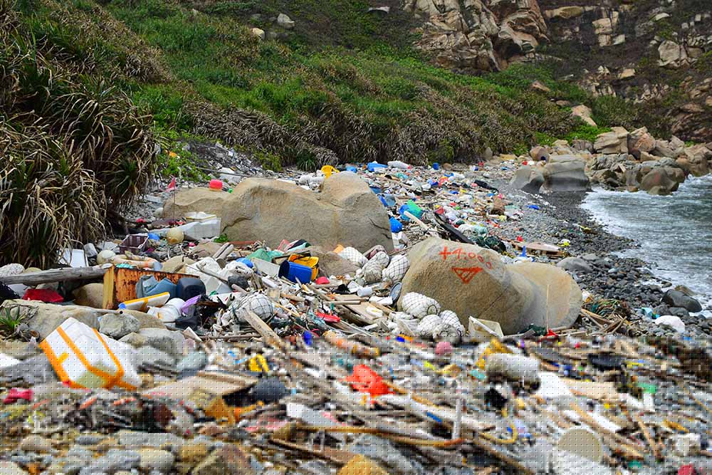 A beach in Hong Kong overrun with plastic on the shoreline.