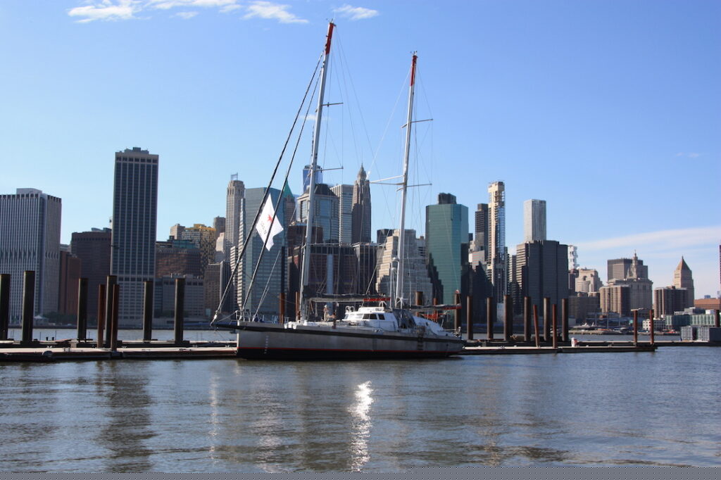 Grain de Sail sailboat on the water cargo vessel
