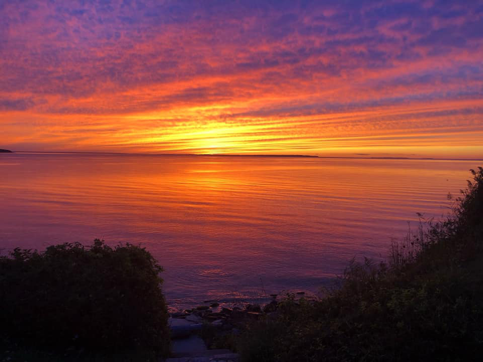 Beautiful sunset over an ocean coastline horizon